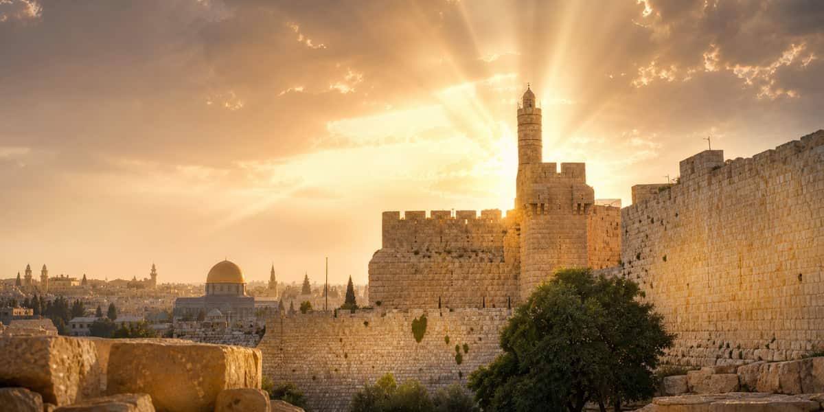 Jerusalem sunrise with open Scriptures and a path of light suggesting response